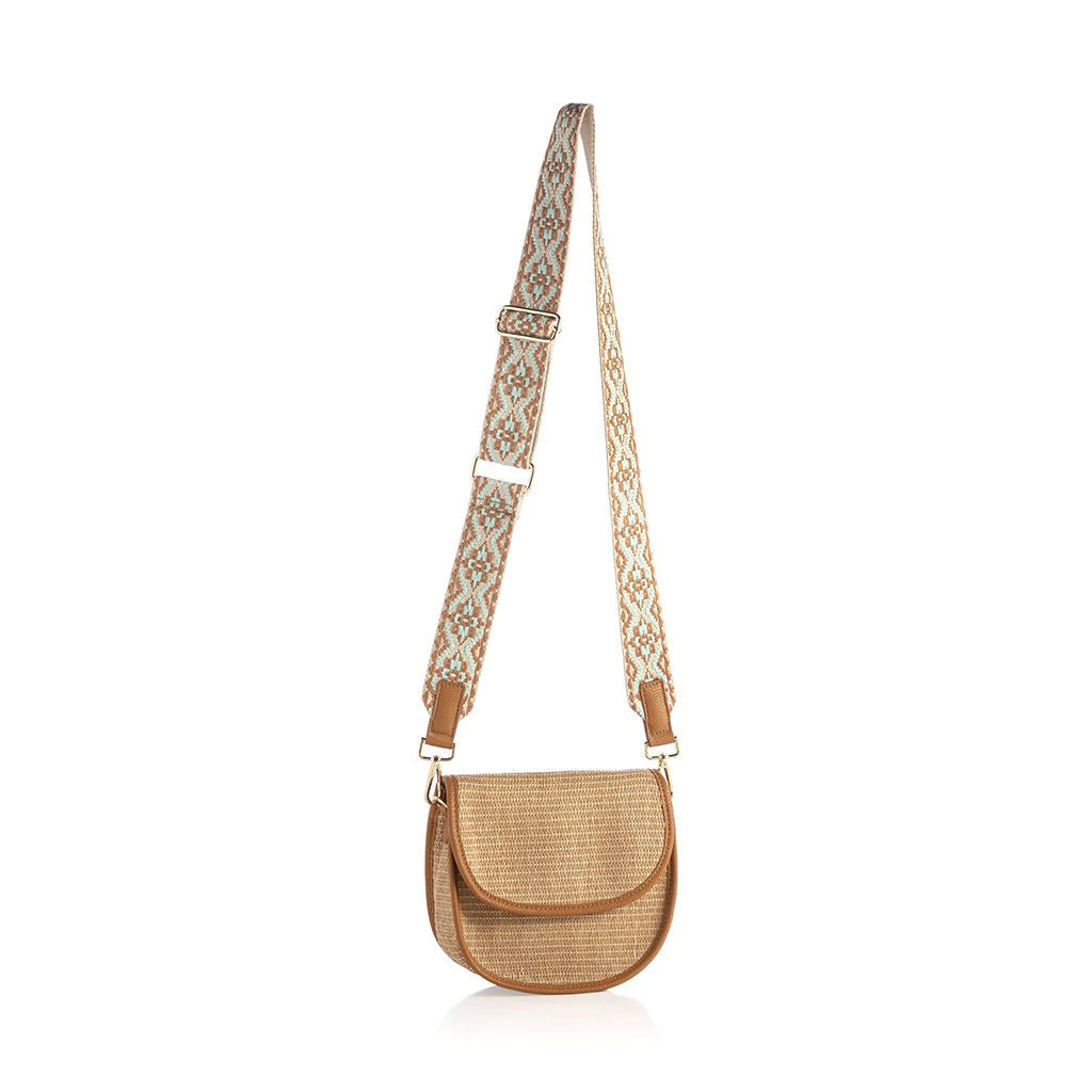 A beige Shiraleah’s Romina Cross-Body bag with a patterned cross-body strap.