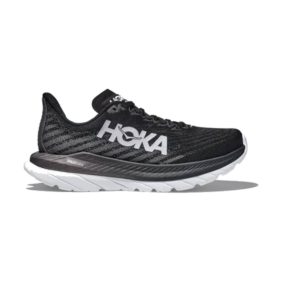 A single Hoka Mach 5 Black/Castlerock - Mens running shoe, showcasing a thick, rubberized EVA sole and the logo prominently displayed on the side.
