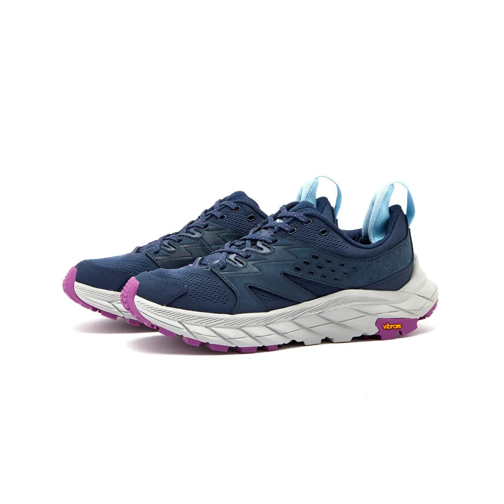 A pair of blue and purple HOKA ANACAPA BREEZE LOW OUTER SPACE/HARBOR MIST - WOMEN sports shoes with a white sole, designed for running, displayed on a white background.