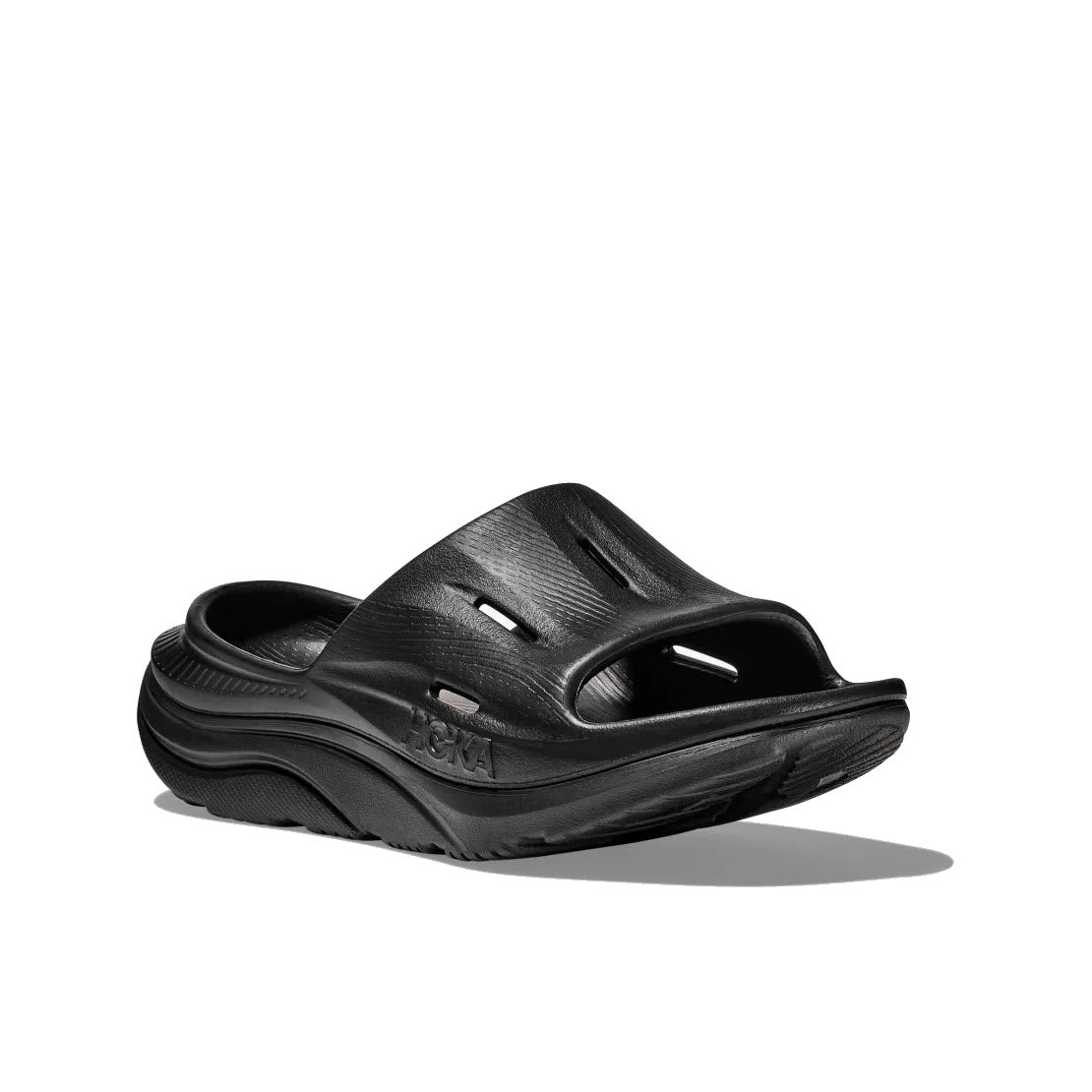 A pair of black textured HOKA ORA RECOVERY SLIDE 3 sandals with a sugarcane footbed against a white background.