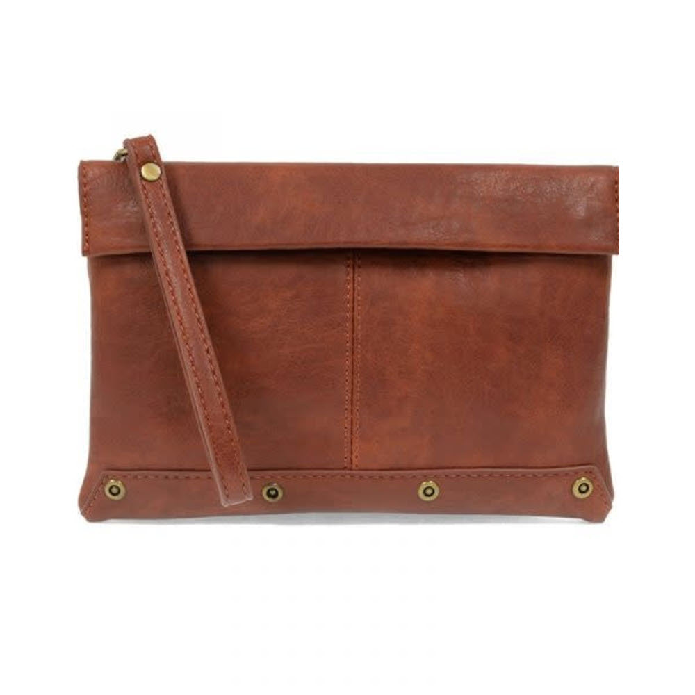 Brown leather KIARA FOLDOVER CROSSBODY BAG SADDLE with a wrist strap and brass rivets by Joy Susan.