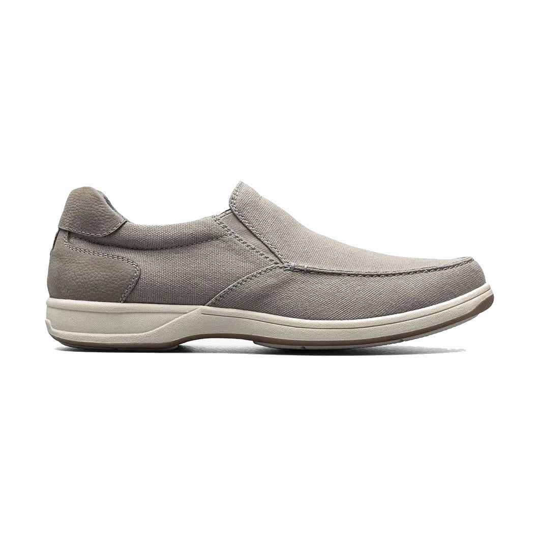 A side view of a single gray Florsheim Lakeside Slip On Canvas Stone with elastic side panels and a white sole.