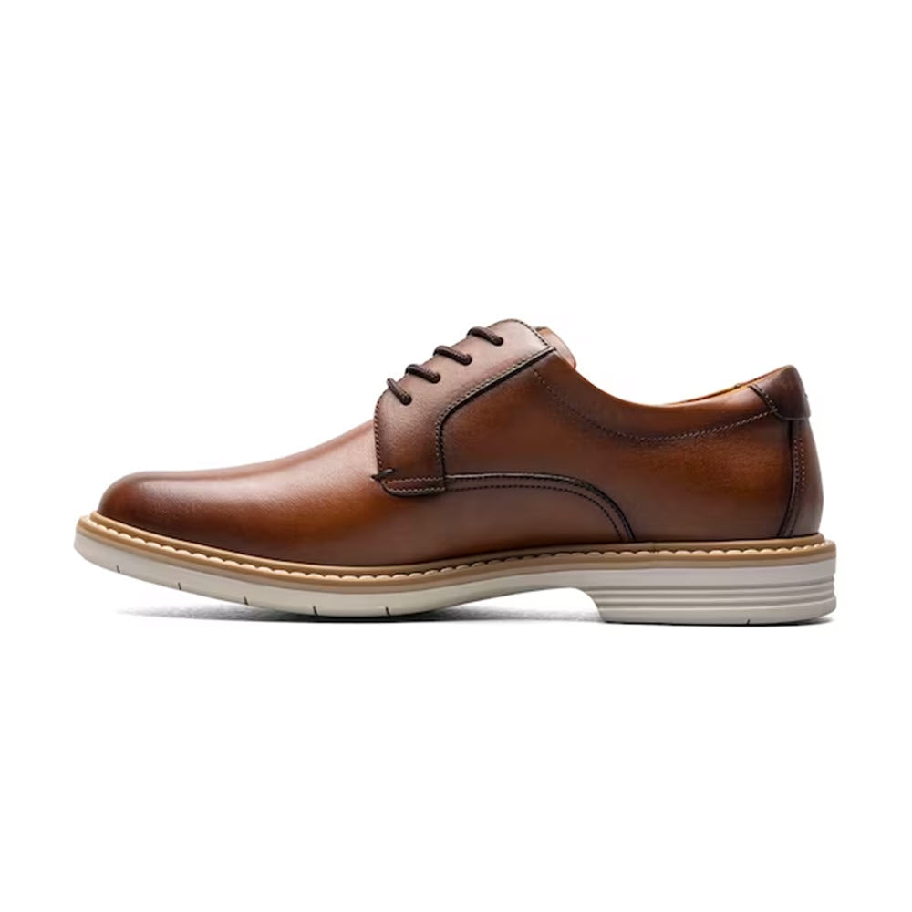 A single brown leather Florsheim Norwalk Plain Toe Oxford Cognac Smooth shoe with laces, displayed against a white background.