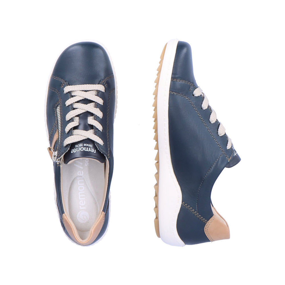 A pair of Remonte Euro City Walker Navy Women&#39;s sneakers with white laces and tan soles, displayed from top and side views on a white background.