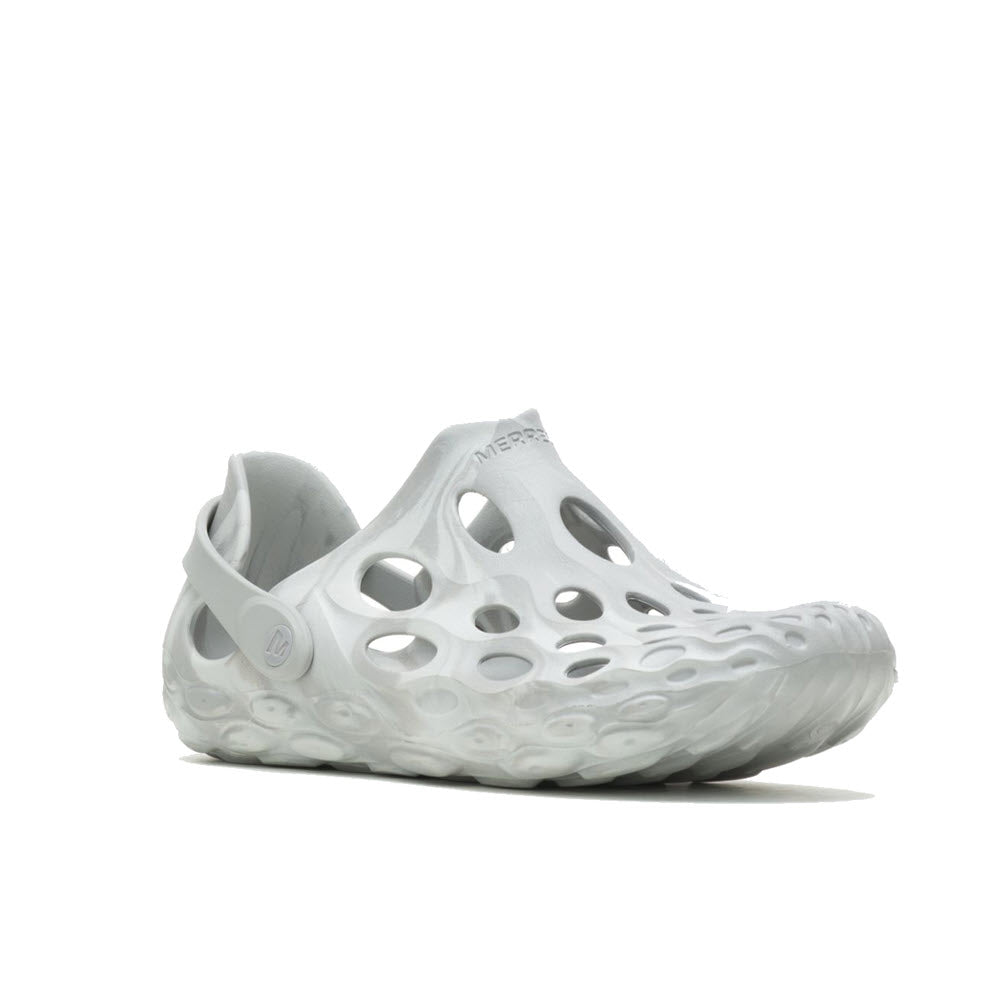 A single white Merrell Hydro Moc Paloma sneaker with multiple circular cutouts and a futuristic design, displayed against a plain white background.