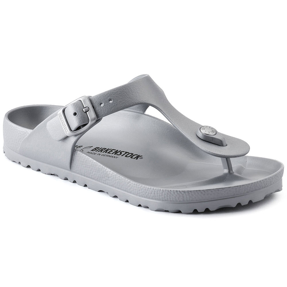 A single Birkenstock Gizeh EVA Metallic Silver sandal with a gray strap and buckle, featuring a toe post and the brand logo embossed on the side.