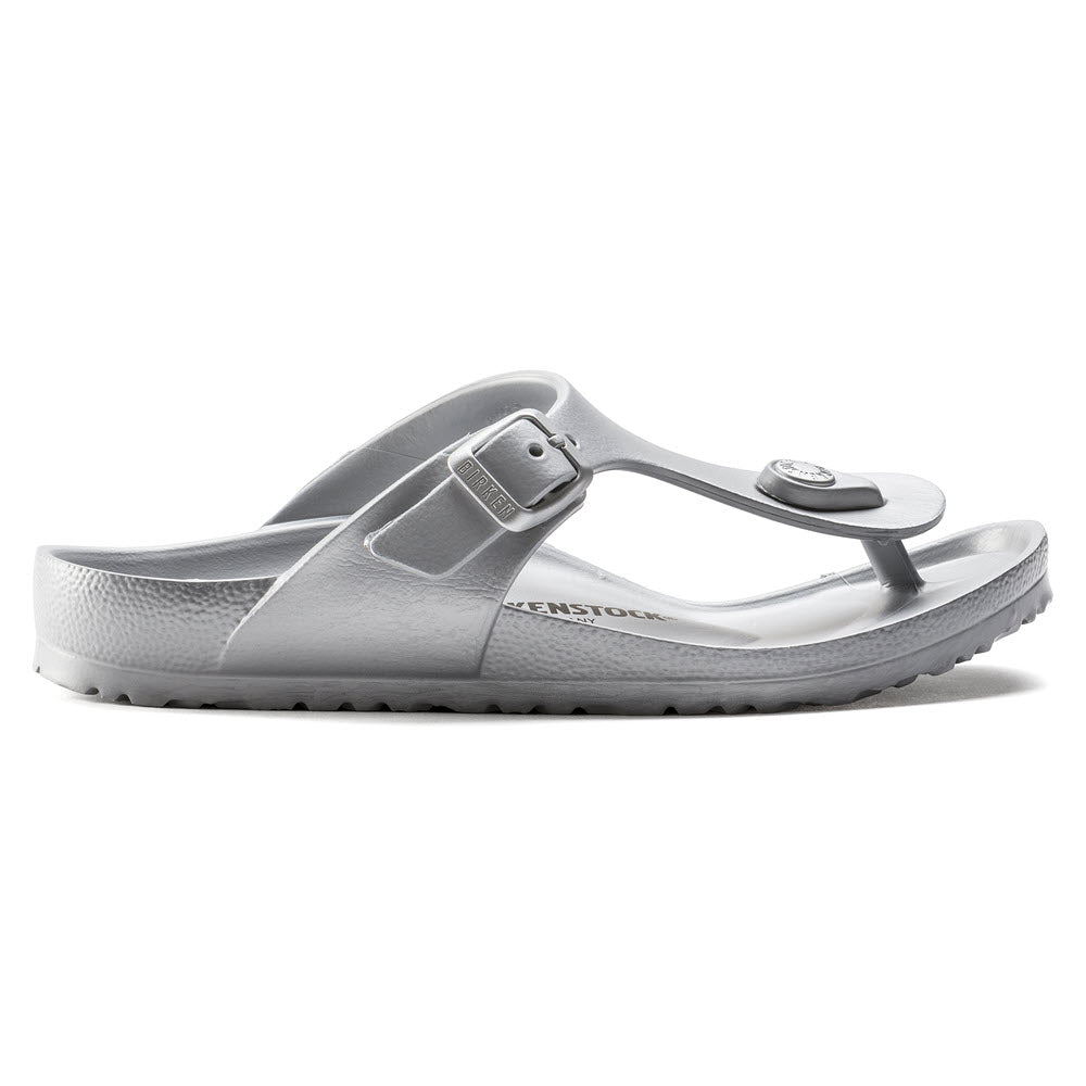 A single gray Birkenstock Gizeh EVA Metallic Silver thong sandal with an adjustable strap and a toe post, displayed against a white background.