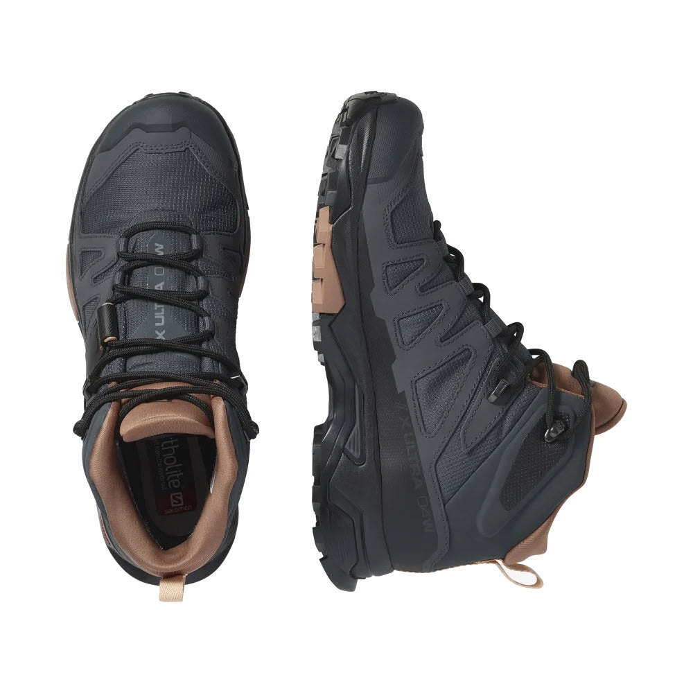 A pair of Salomon X Ultra 4 Mid GTX ebony/mocha mousse/almond cream women&#39;s hiking boots with brown accents viewed from above and the side, showcasing the grippy outsole and design.