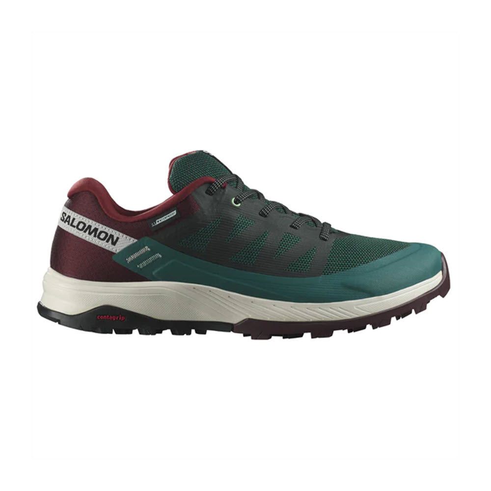 Green Salomon OUTRISE CSWP PONDEROSA PINE trail running shoe with white sole and red accents, side view on a white background.