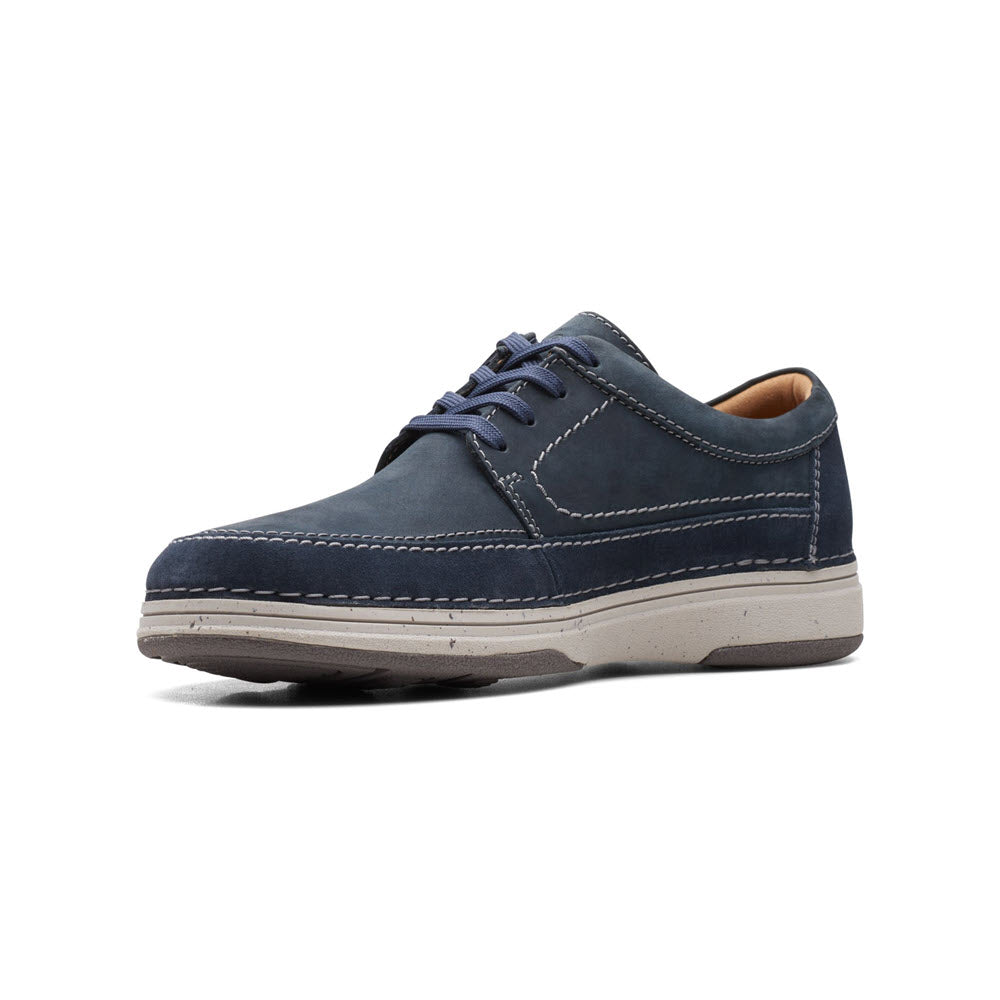 Single navy blue nubuck upper leather Clarks Nature 5 Lo Oxford shoe with white soles, displayed in profile view on a white background.