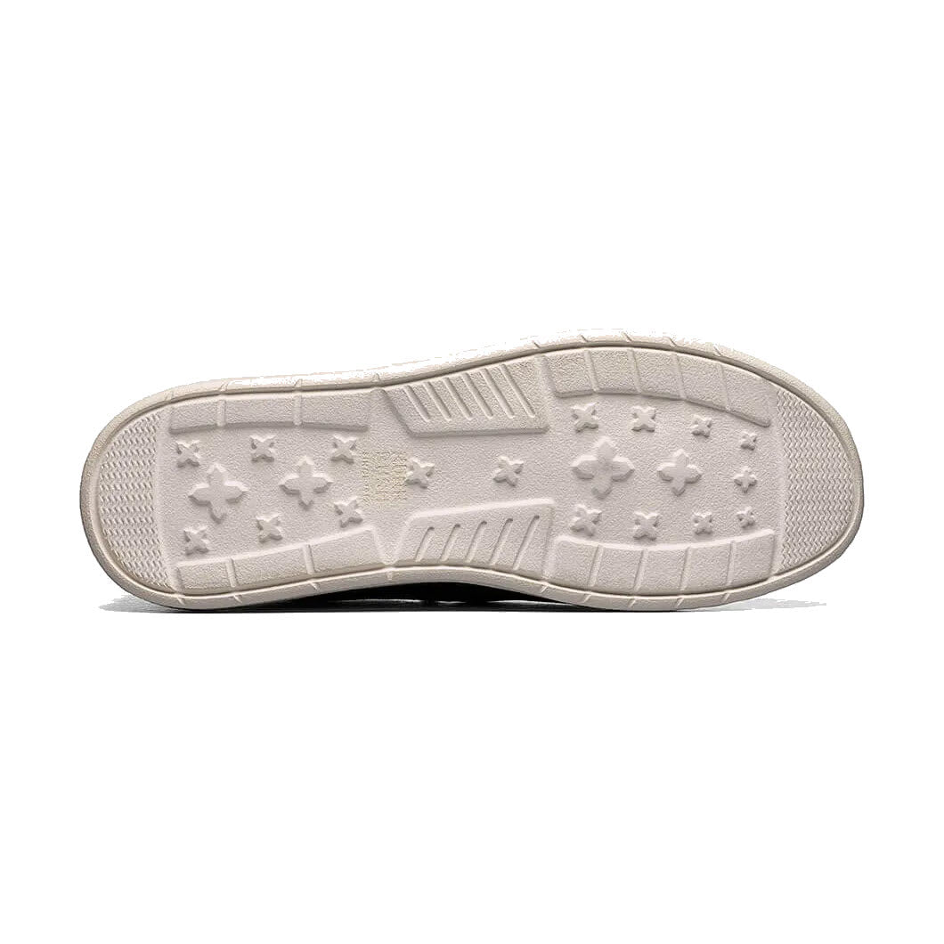 Sole of a gray Nunn Bush Brewski Moc Toe Slip On sneaker with a pattern of stars and lines, shown against a white background.