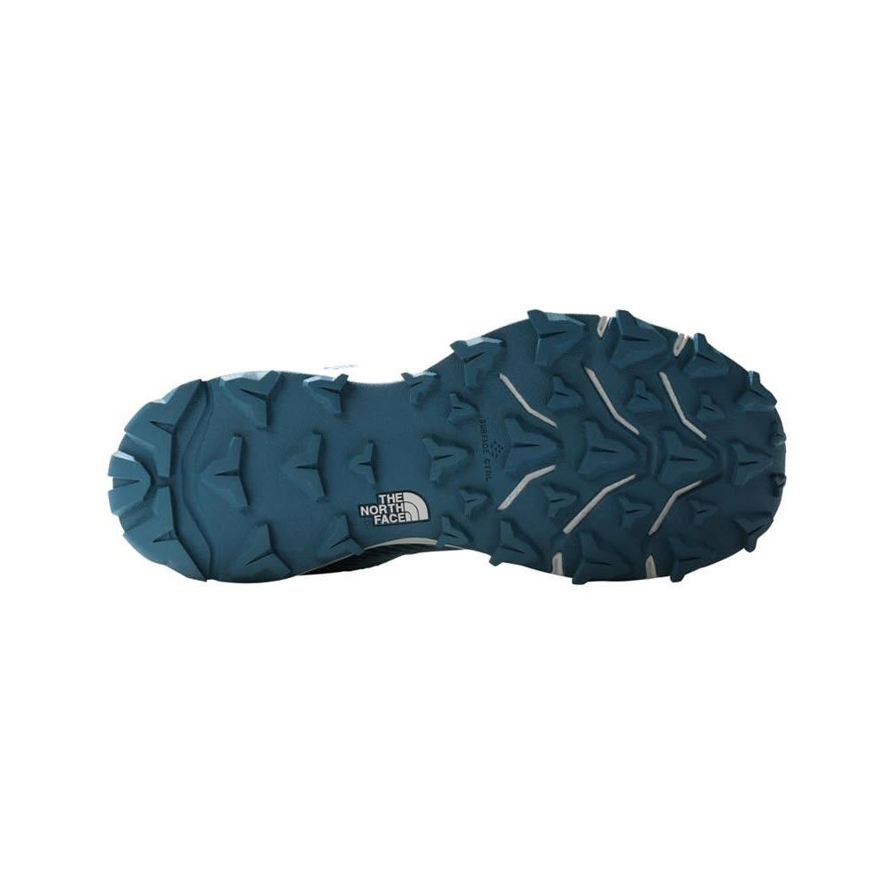 Sole of a NORTH FACE VECTIV FASTPACK FUTURELIGHT REEF WATERS/BLUE CORAL - WOMENS hiking shoe with deep tread patterns, featuring the Surface Control rubber sole.