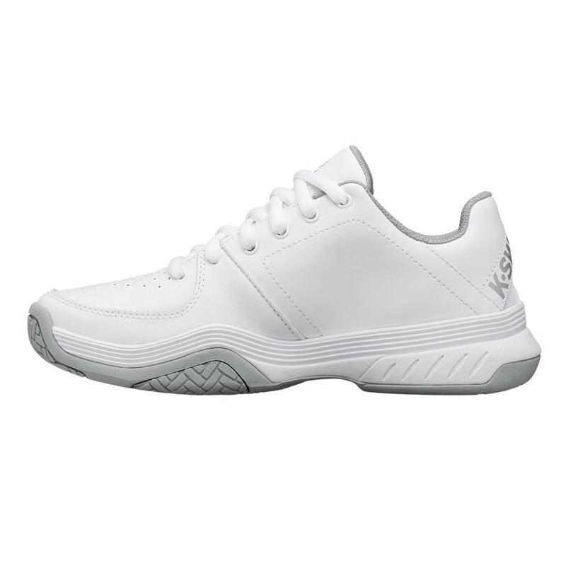 Side view of a K-SWISS COURT EXPRESS WHITE/GREY - WOMENS athletic tennis shoe with lace-up front, a thick sole, and logo on the heel.