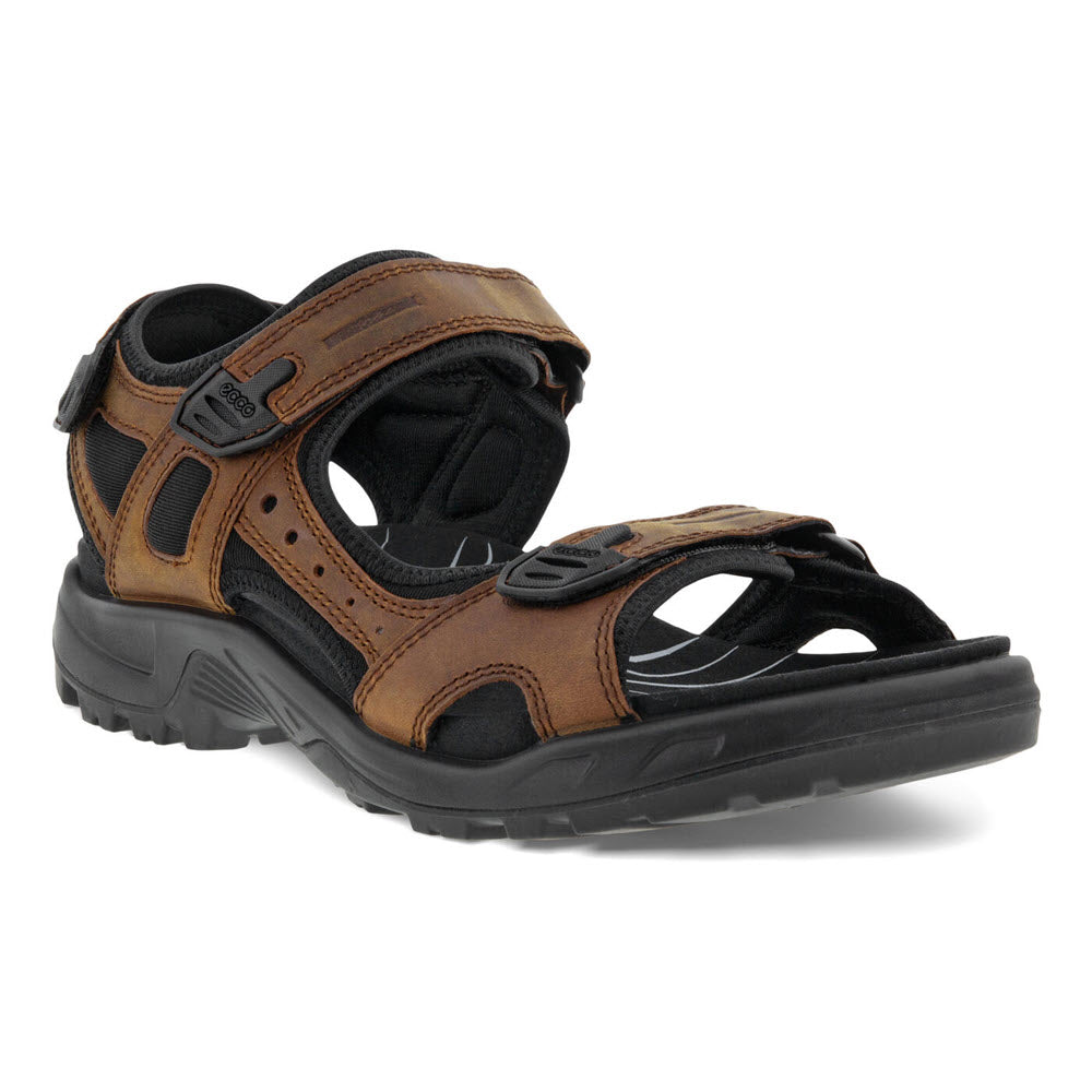 A brown leather Ecco Yucatan M Plus Sierra sandal with adjustable straps and a black rubber sole, shown against a white background.