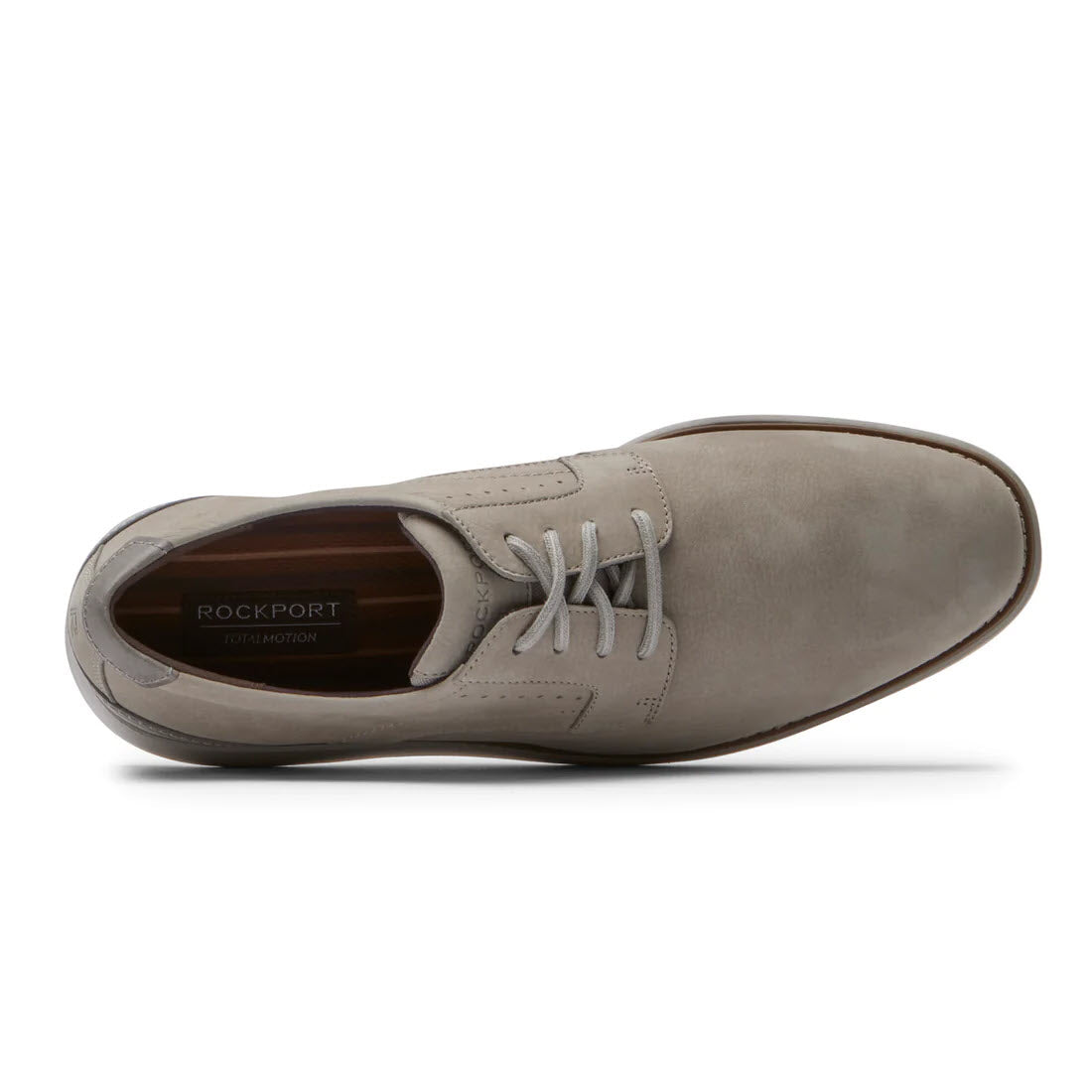 Top view of a single grey Rockport Total Motion Craft Oxford men&#39;s shoe with white laces on a white background.