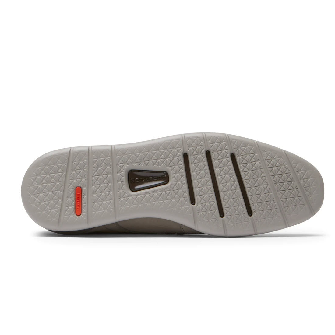 Sole of a modern Rockport shoe featuring a gray rubber tread with a textured diamond pattern and a rectangular logo embedded near the midsole.