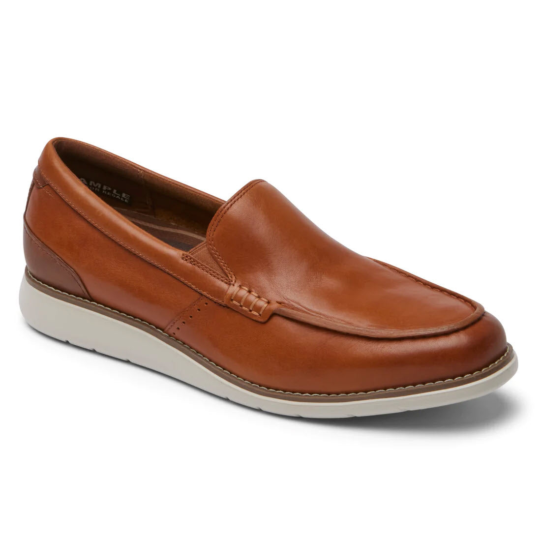 A single Rockport Total Motion Craft Venetian Cognac men&#39;s loafer with a white sole, displayed against a plain white background.