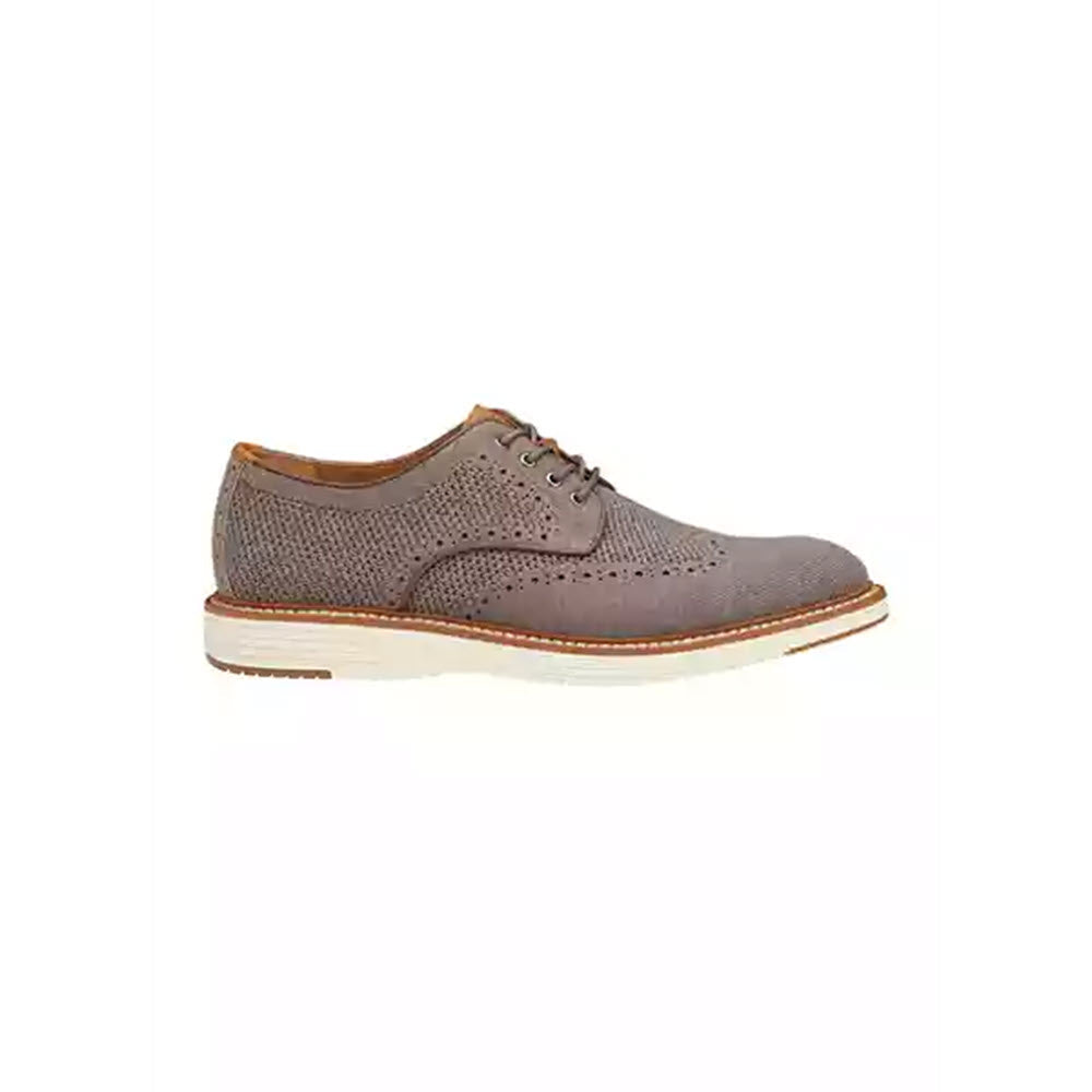 A Johnston & Murphy Upton Knit Wing Tip Gray - Mens brogue shoe with perforated details and a contrasting white sole, isolated on a white background.