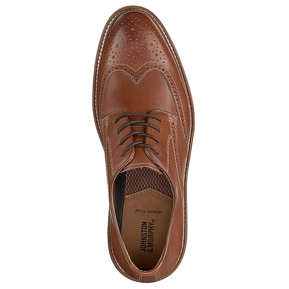 Top view of a brown leather Johnston &amp; Murphy Upton Wingtip Tan shoe with TRUFOAM cushioning, brogue detailing, and dark brown laces.