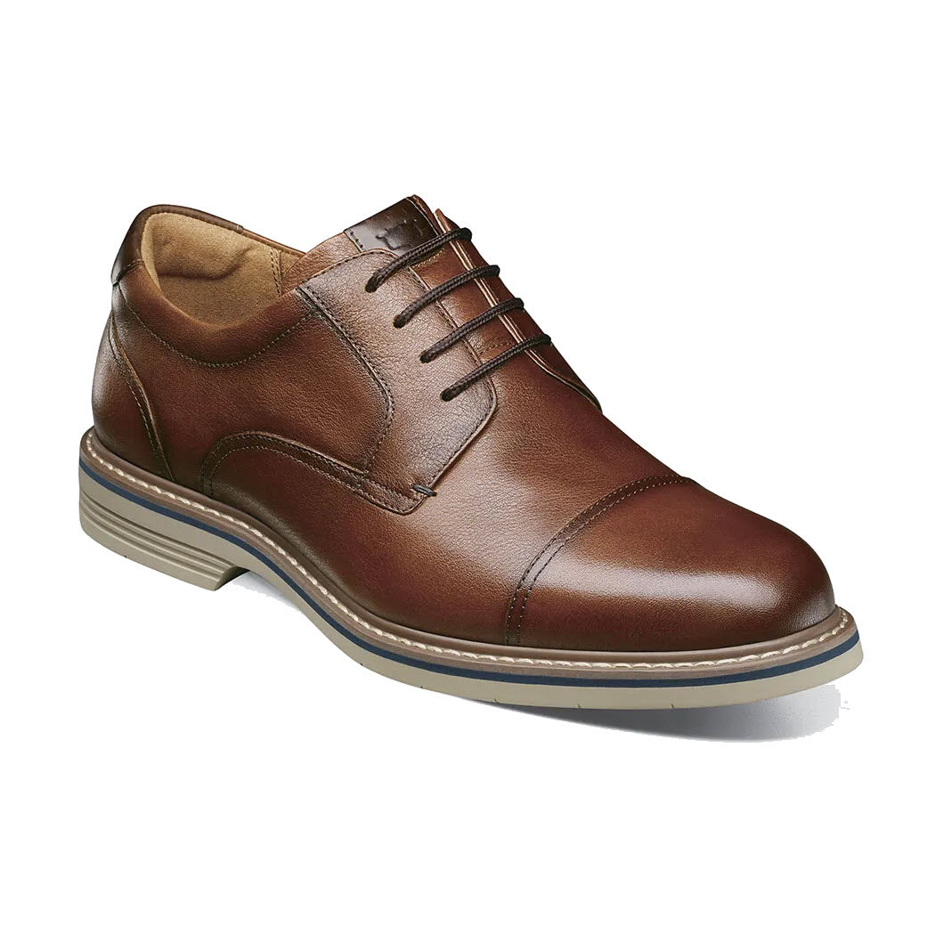 A single Florsheim Norwalk Plain Toe Crazy Horse Oxford with detailed stitching and Flexsole technology, featuring a light-colored sole, displayed against a white background.
