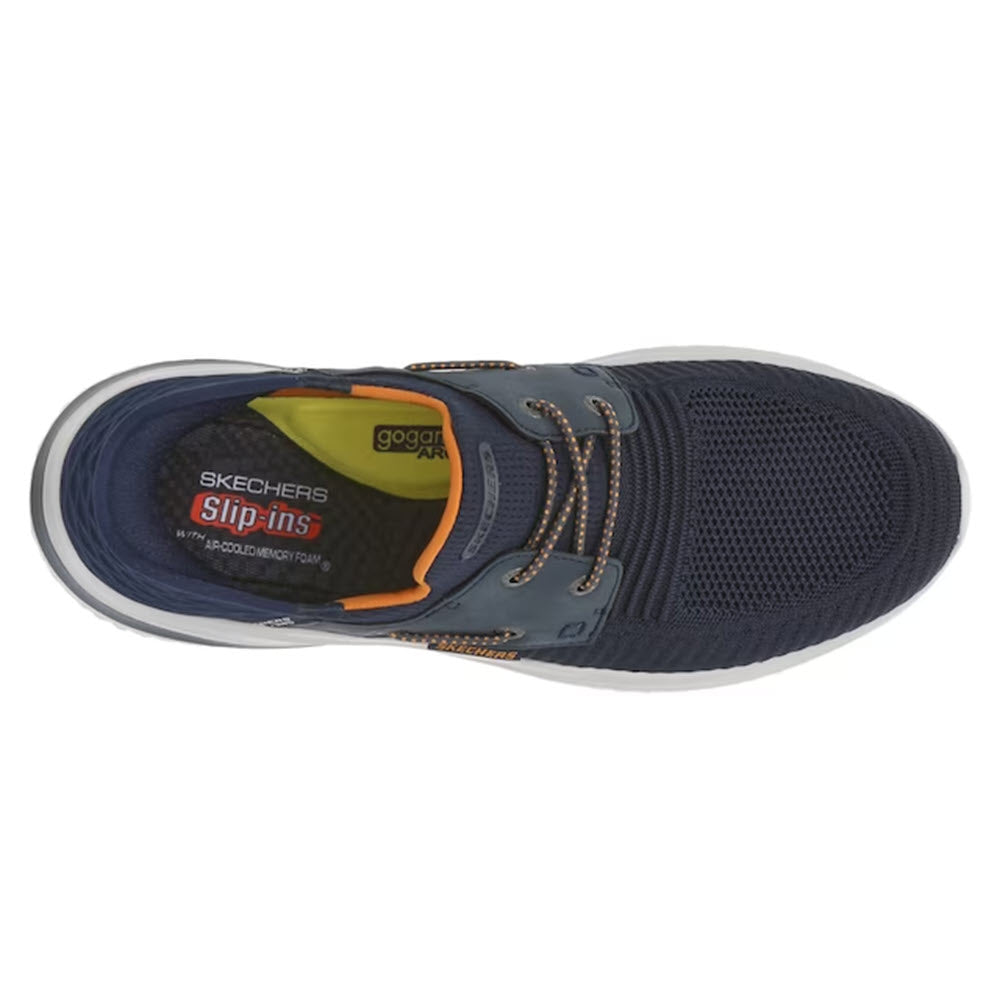 Top view of a navy blue Skechers ROTH Low Profile Bungee Lace Slip-ins shoe with orange and grey accents, Air-Cooled Memory Foam, and visible brand labels inside.
