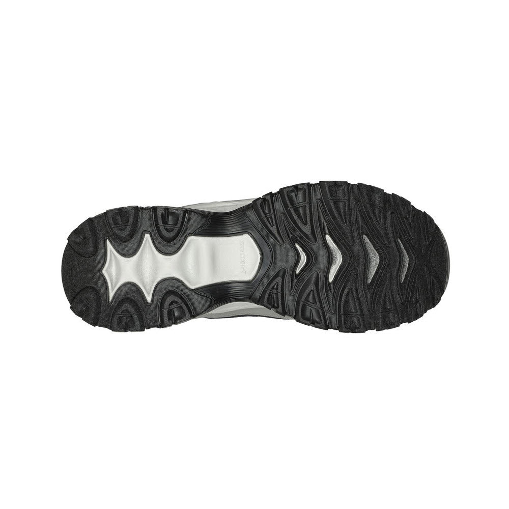 Bottom view of a single black and silver athletic shoe sole with intricate tread patterns featuring Skechers ARCH FIT Slip-ins.