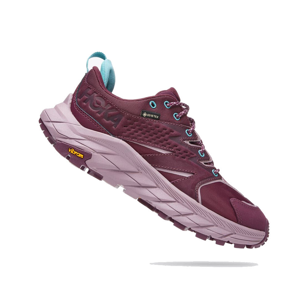 A single maroon Hoka Anacapa Low GTX running shoe with a vibram sole and teal accents, displayed against a white background.