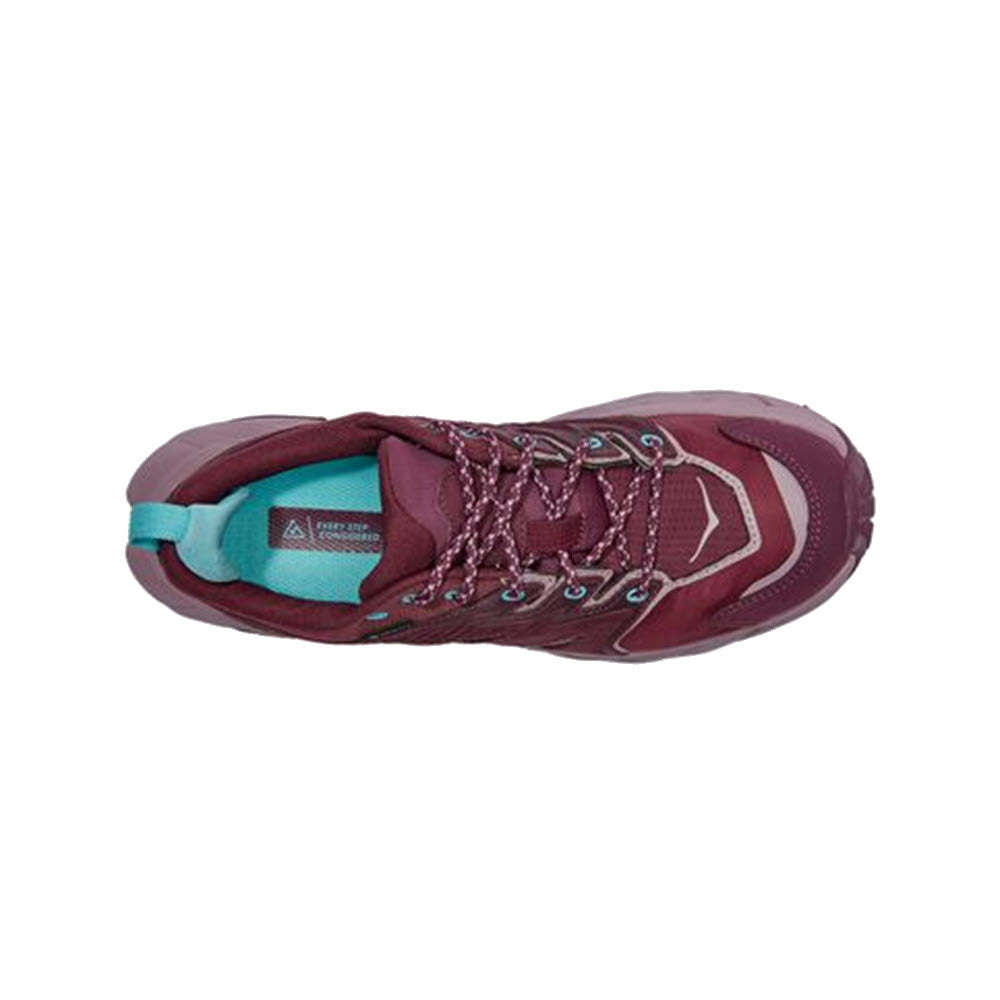 Top view of a single HOKA ANACAPA LOW GTX GRAPE WINE/ELDERBERRY - WOMENS hiking shoe crafted from lightweight leather with teal inner lining and laces, featuring a triangular logo on the tongue.