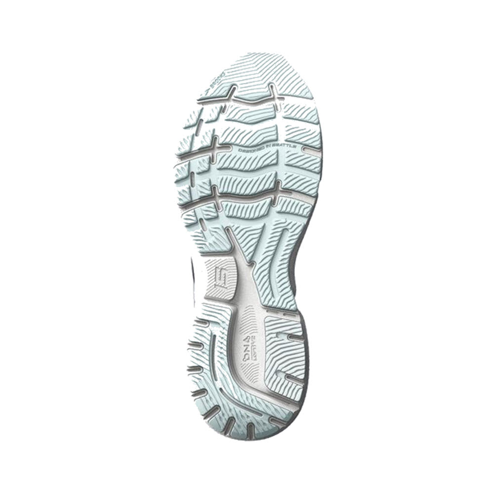 A detailed view of the sole of the Brooks Ghost 15 running shoe, featuring soft cushioning, a complex tread pattern, and branding.