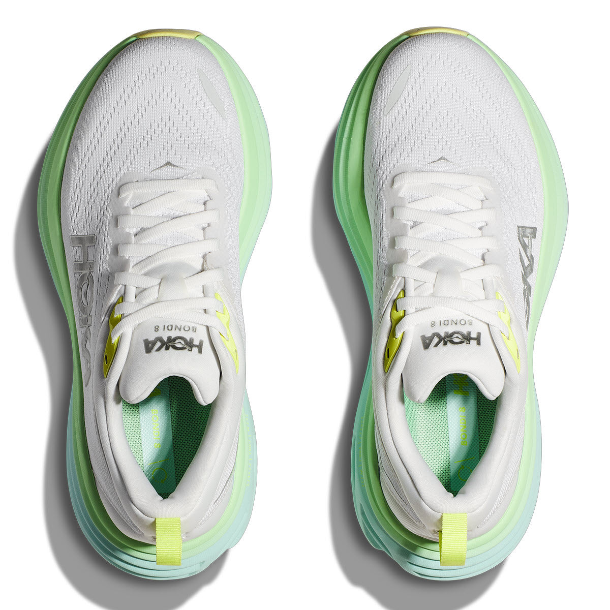 A pair of white Hoka Bondi 8 Blanc de Blanc/Sunlit Ocean running shoes with neon green accents and extended heel geometry, viewed from above.