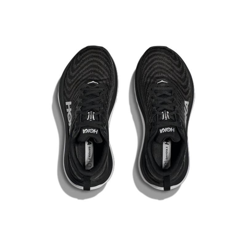 A pair of HOKA GAVIOTA 5 black stability shoes with white Hoka branding displayed on a white background.