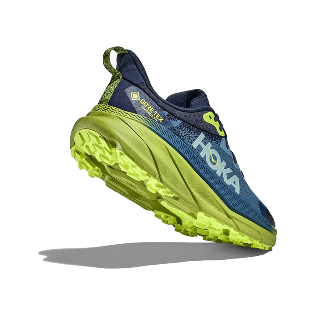 A single Hoka Challenger ATR 7 GTX OUTER SPACE/DARK CITRON trail running shoe with a GORE-TEX INVISIBLE FIT label, featuring a blue upper and bright yellow sole, displayed against a white background.