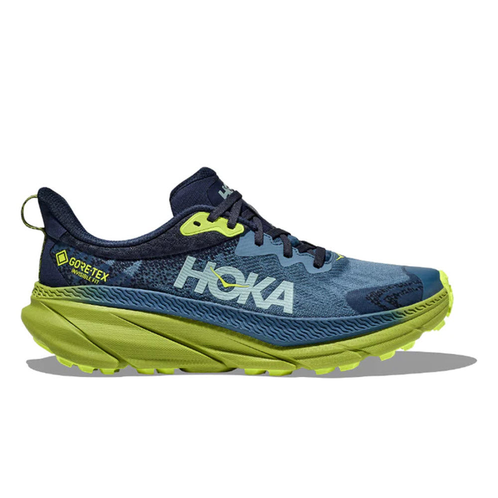 A blue and yellow Hoka Challenger ATR 7 GTX running shoe with GORE-TEX INVISIBLE FIT label on the side, displayed on a white background.