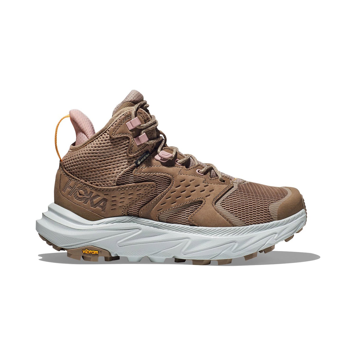 Hoka hiking boot with a ventilated upper, lace-up front, and a small pull tab on the heel, isolated on a white background.