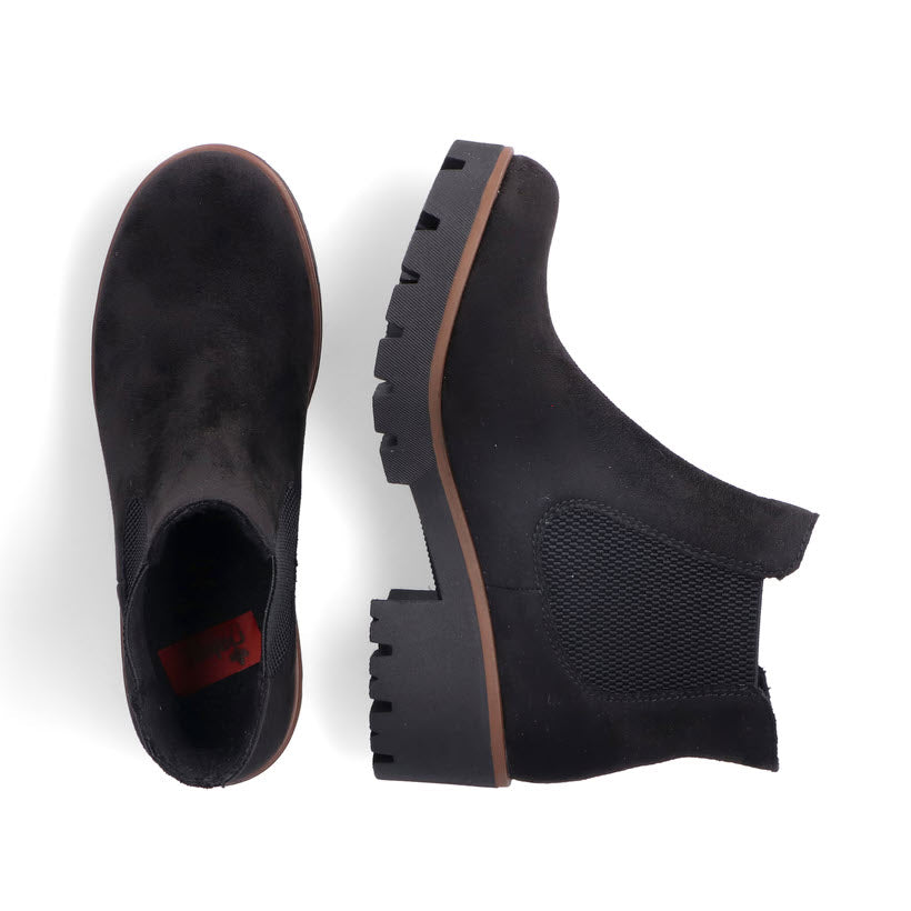 Top-down view of a pair of RIEKER CHUNKY HEEL CHELSEA BLACK STRETCH - WOMENS by Rieker with chunky soles, elastic inserts, and extra soft insoles, placed on a white background.