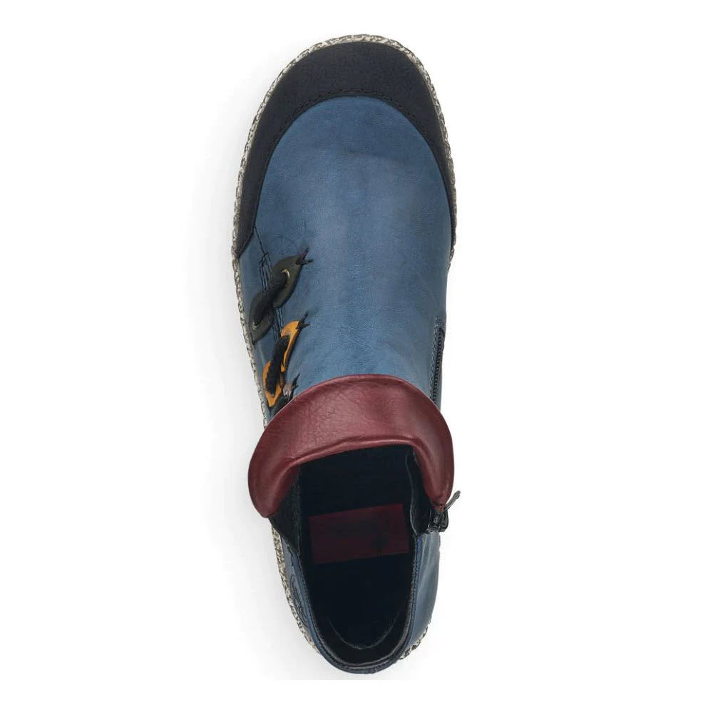 Top view of a blue and burgundy Rieker faux leather shoe with a small fox design on the side, designed for children.