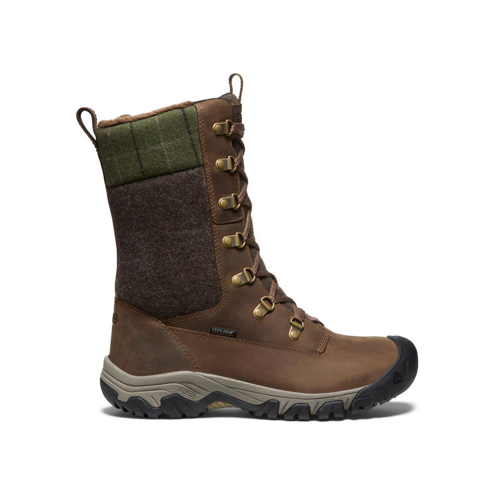 A high-quality hiking boot featuring brown leather, green plaid textile, metal eyelets, and a rugged rubber sole with cold-weather traction from Keen&#39;s Greta Tall Boot Dark Earth for women.