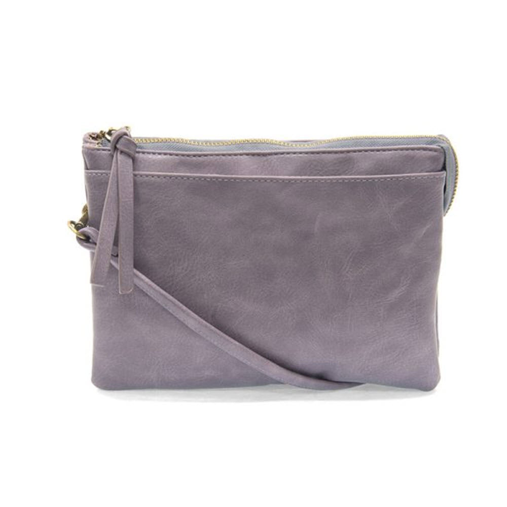 A small JOY SUSAN PIPER MULTI POCKET BAG AMETHYST with a top zip closure, displayed against a white background.