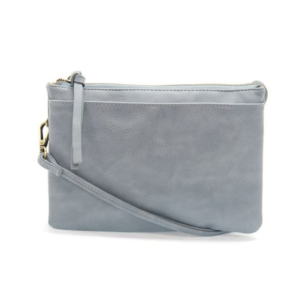 A Joy Susan light gray leather wristlet with a top zip closure and a thin strap, isolated on a white background.