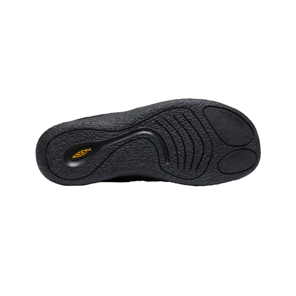 Hybrid slip-on sole of a Keen Howser III Slide Triple Black - Mens shoe with textured design and visible brand logo &quot;Keen.