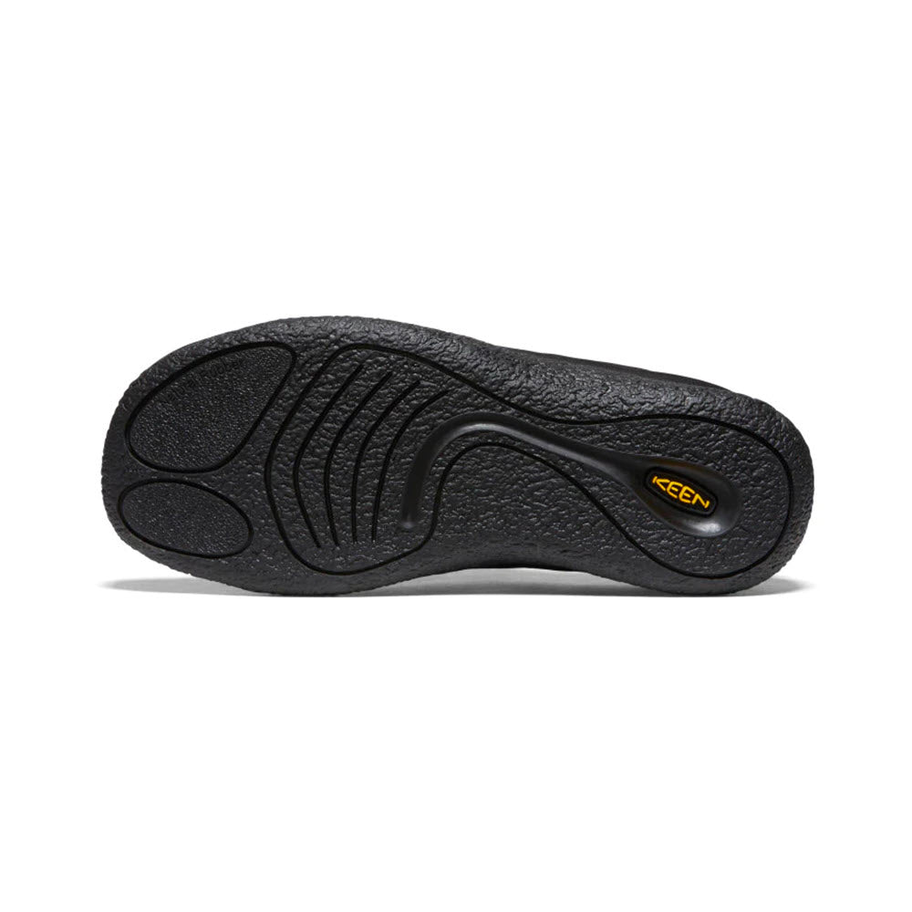 Black shoe sole with textured tread for superior traction, featuring an engraving of the brand name &quot;Keen&quot; in yellow near the heel area. Designed as a hybrid comfort slide, perfect for everyday wear, this product is called KEEN HOWSER III SLIDE BLACK SMOOTH NYLON - WOMENS.