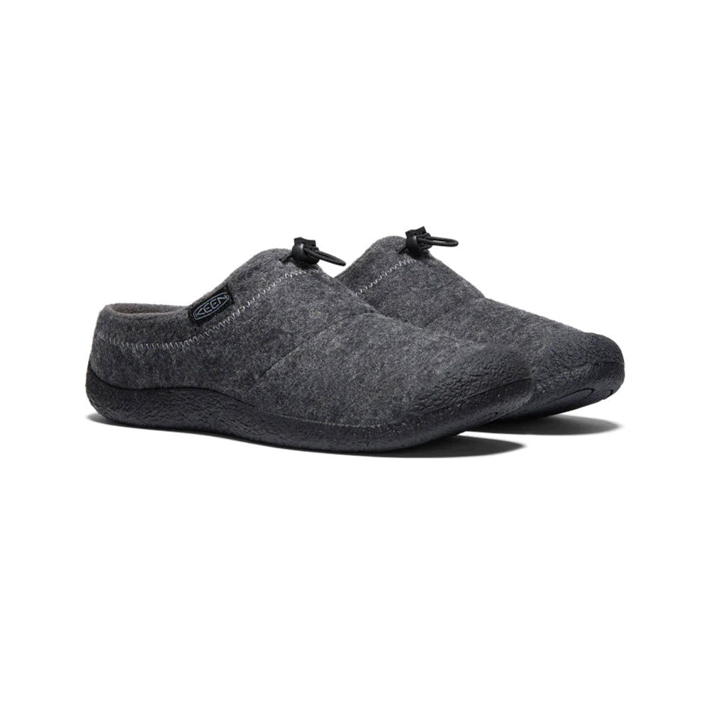 A pair of Keen Howser III Slide Charcoal Grey Felt slippers with cozy fleece lining and adjustable black drawstring closures on a white background.