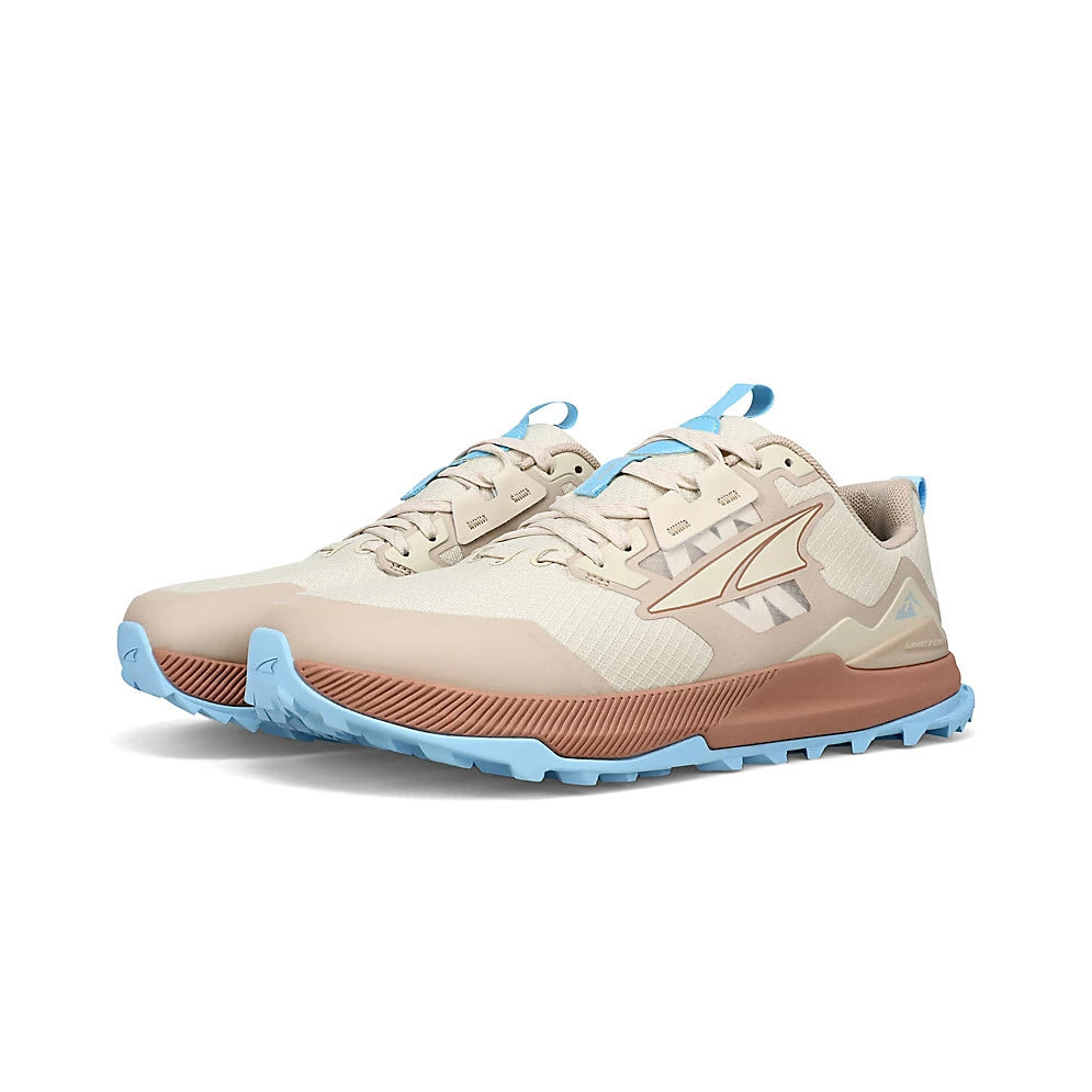 A pair of Altra Lone Peak 7 Tan trail running shoes with a MaxTrac™ outsole and a dynamic design on the side.
