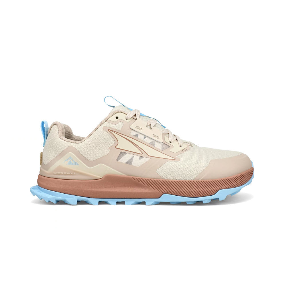 A light beige trail shoe with a blue sole and blue accents on the laces and heel, featuring a prominent triangular logo on the side and equipped with a MaxTrac™ outsole, such as the Altra Lone Peak 7 Tan - Womens.