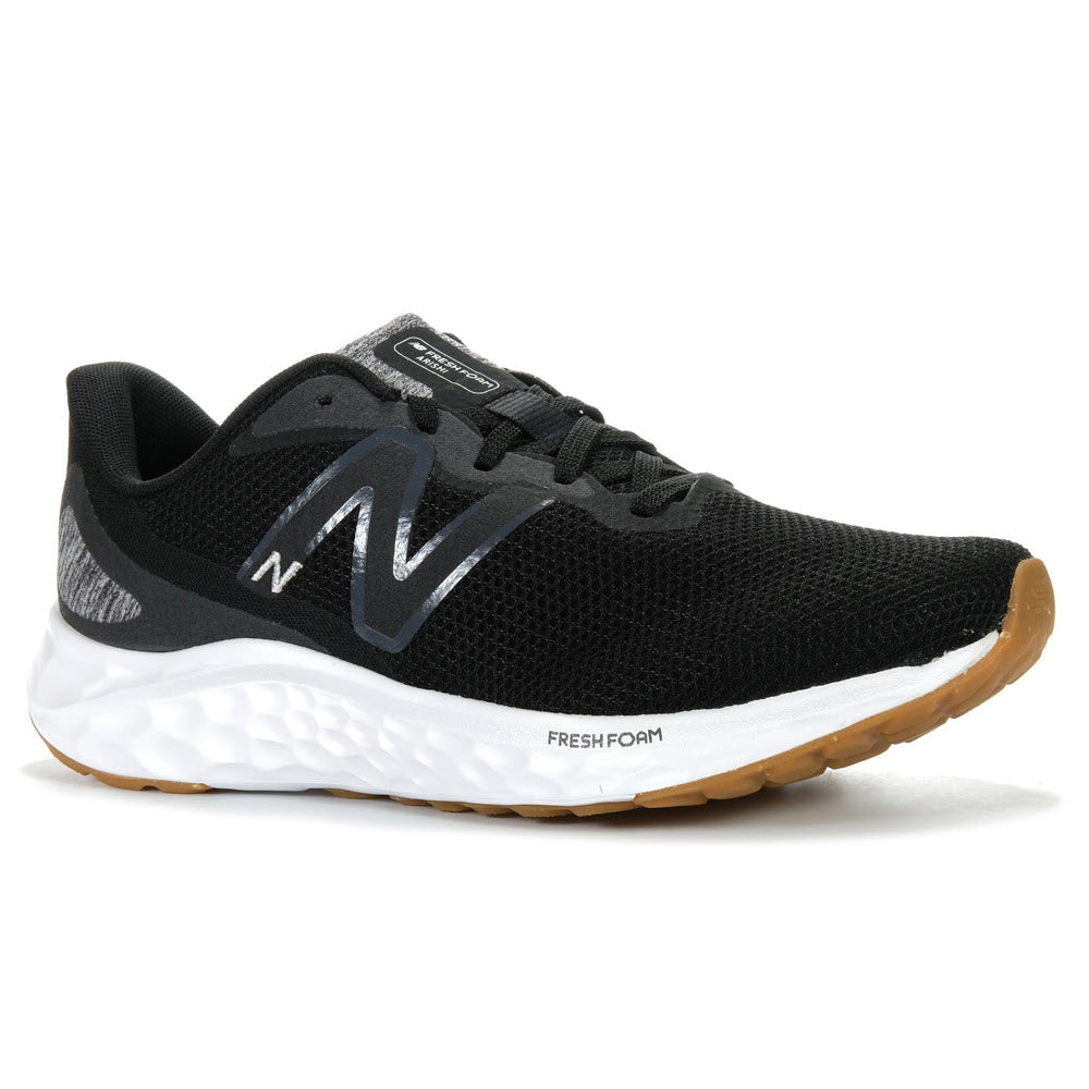 A black New Balance athletic shoe with white &quot;NEW BALANCE FRESH FOAM ARISHIV4&quot; sole and a prominent &quot;n&quot; logo on the side.