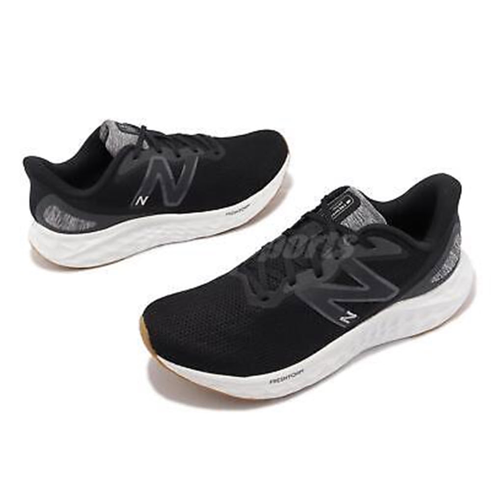 A pair of black New Balance Fresh Foam Arishi v4 running shoes with a breathable mesh upper, displayed on a white background.