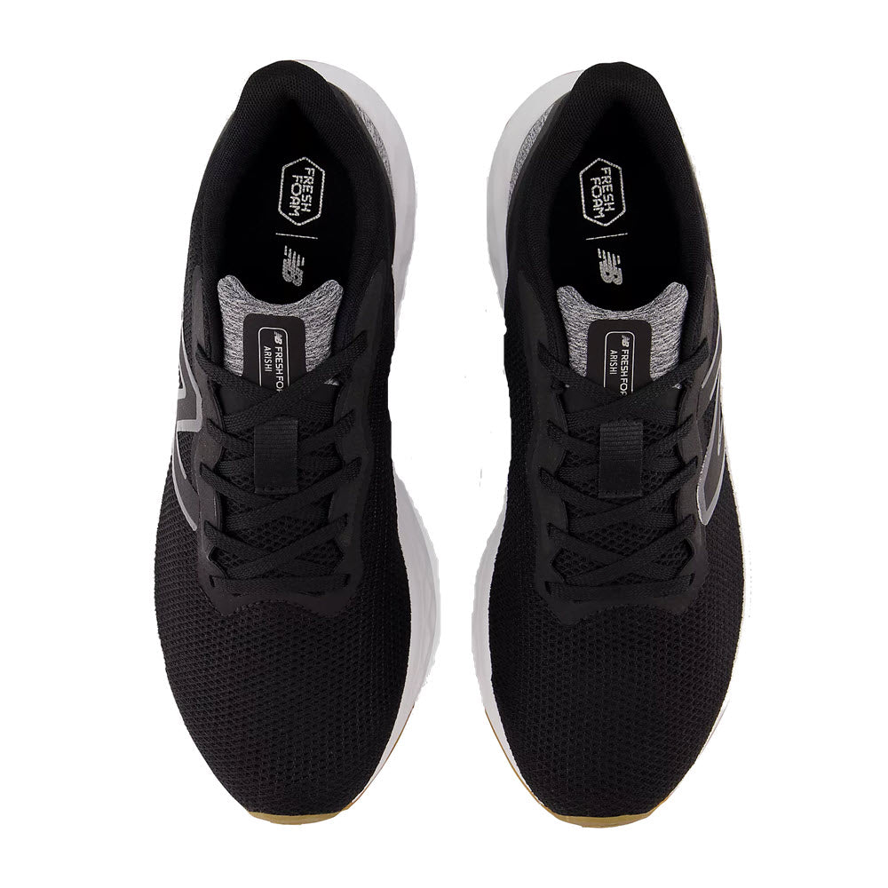 Top view of a pair of black and white New Balance Fresh Foam Arishi v4 athletic shoes on a white background.