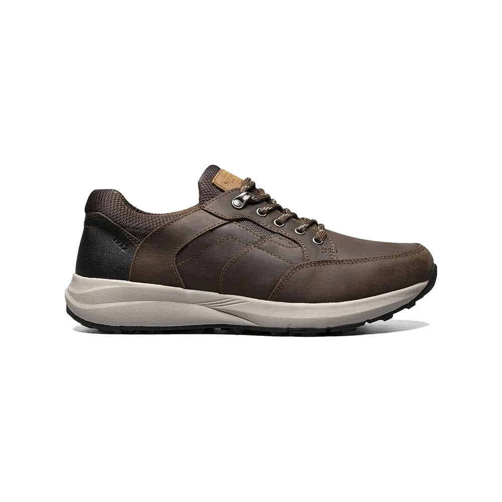 A single brown NUNN BUSH EXCURSION MOC TOE OXFORD CRAZY HORSE BROWN men's sneaker with laces, featuring a white sole and dark accents, displayed against a plain white background.