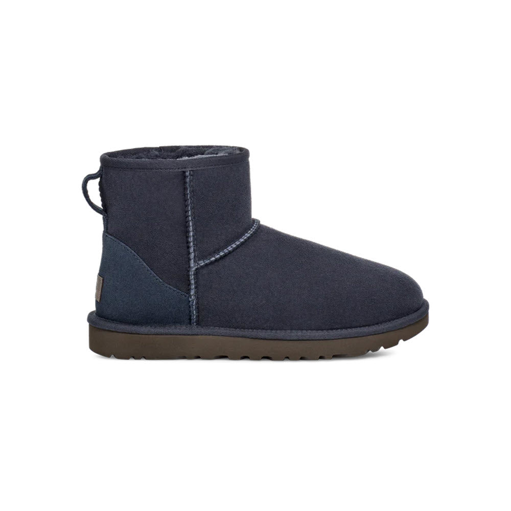 Navy blue UGG Classic Mini II Eve Blue - Womens short boot with a Twinface sheepskin exterior and a plush lining, featuring a rear pull tab and a flat rubber sole.