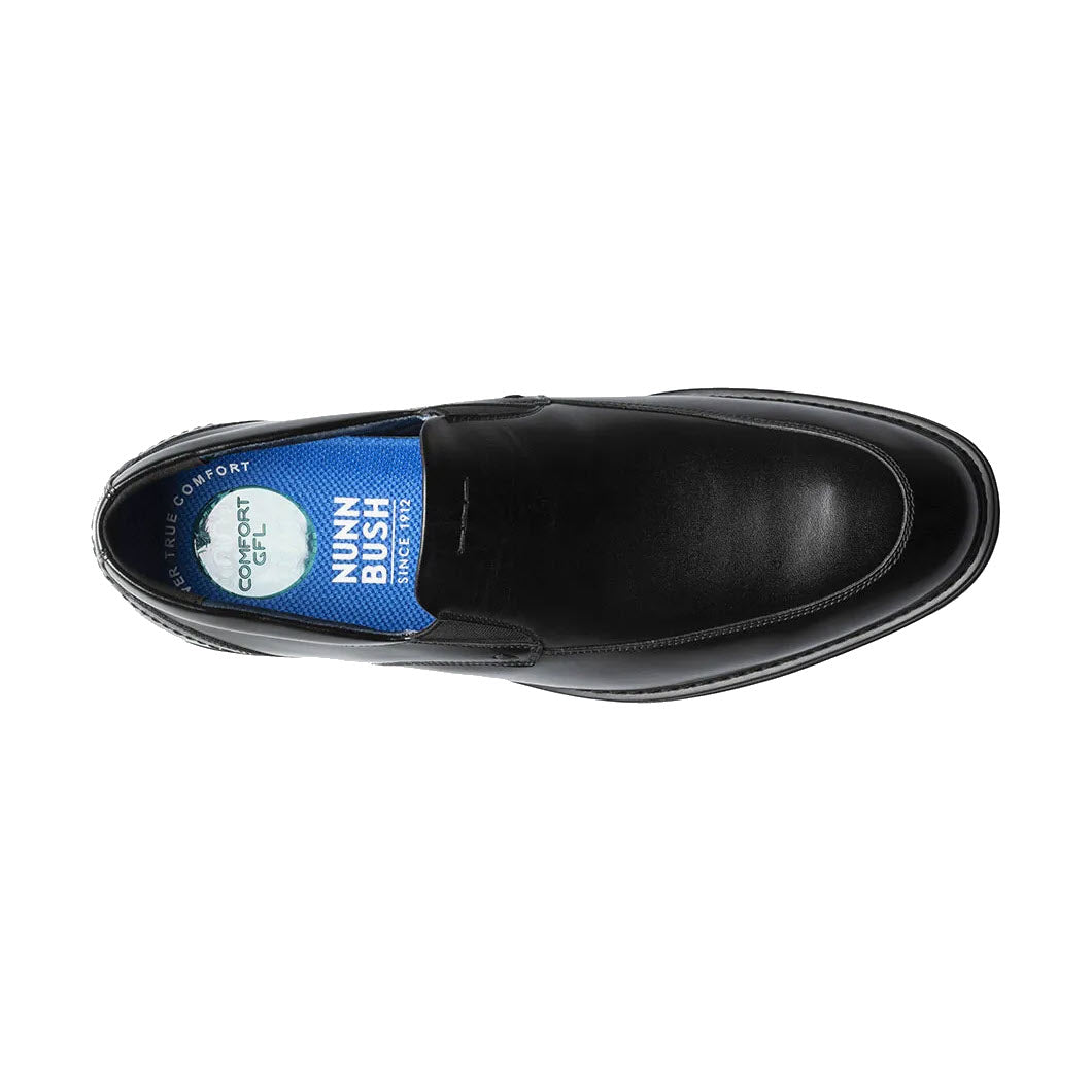 Top view of a Nunn Bush Centro Flex moc toe venetian black smooth men&#39;s dress shoe with a blue insole, displaying the brand &quot;Nunn Bush Centro Flex&quot; and labeled &quot;Softgel heel pod.